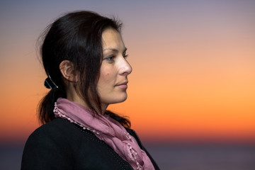 Portrait of beautiful young woman looking aside