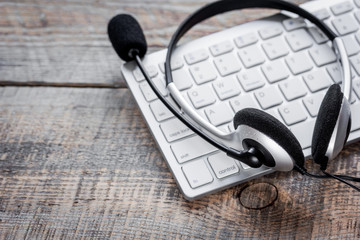 Call center support table with headset and keyboard