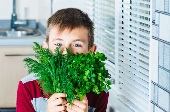 The child in the kitchen with herbs