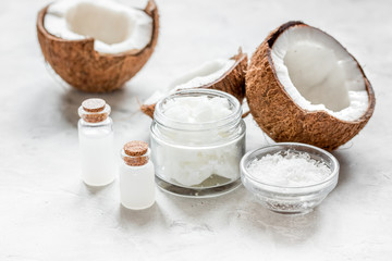 cosmetic concept with fresh coconuts on white table background