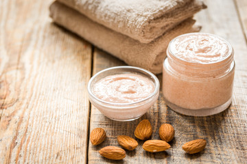 natural scrub with almond on wooden table background
