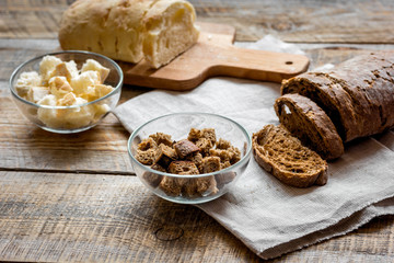 traditional sliced bread with crumbs wooden table background