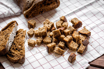 traditional sliced bread with crumbs wooden table background