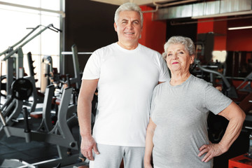 Fototapeta na wymiar Senior sporty couple in gym
