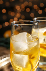 Glass with delicious wine spritzer on dark background