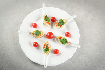 Plate with stuffed pasta on table