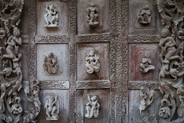 Close-up of beautiful wood carvings at the wooden Shwenandaw Monastery (also known as Golden Palace Monastery) in Mandalay, Myanmar (Burma).