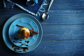 Fototapeta premium Tasty pears with sweet sauce on wooden table