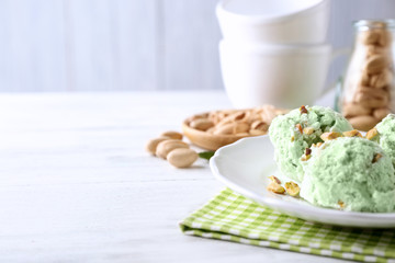 Plate with delicious pistachio ice cream, close up