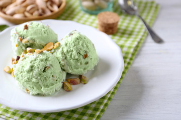 Plate with delicious pistachio ice cream, close up