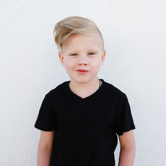 young emotional boy on bright background