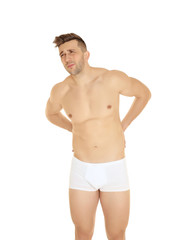 Fototapeta premium Young man suffering from back pain on white background