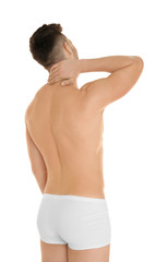 Naklejka premium Young man suffering from neck pain on white background