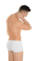 Fototapeta premium Young man suffering from neck pain on white background