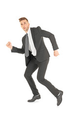 Handsome running businessman on white background