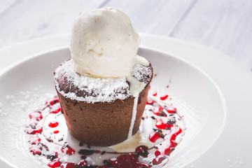 Chocolate lava cake Molten with melting ice cream on plate and white background