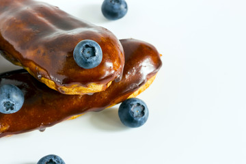 Homemade chocolate eclair with blueberry