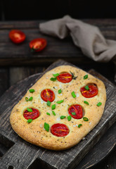 Italian focaccia with tomatoes top view