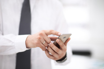 Mock up of a man holding device and touching screen