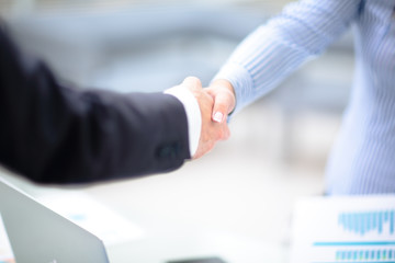 Close up view of business partnership handshake concept.Photo of two businessman handshaking process.Successful deal after great meeting.