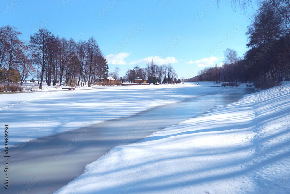 Sticker beautiful winter landscape with frozen river and blue sky