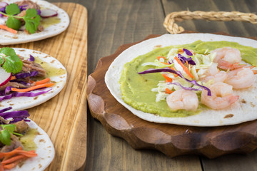 Shrimp taco with guacamole.