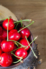 Fresh ripe organic cherries on wooden background.