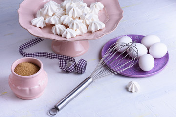Fototapeta na wymiar French dessert - meringues. Bakery products. Close up confectionery ingredients.