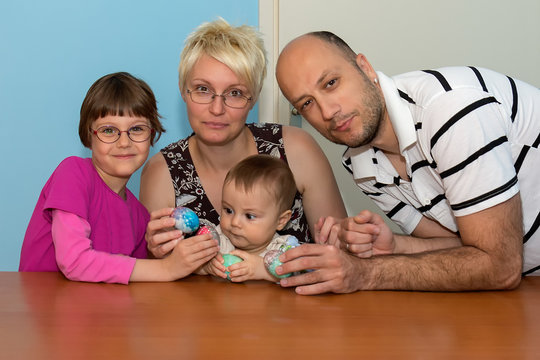 Family Having Breakfast On Easter Day