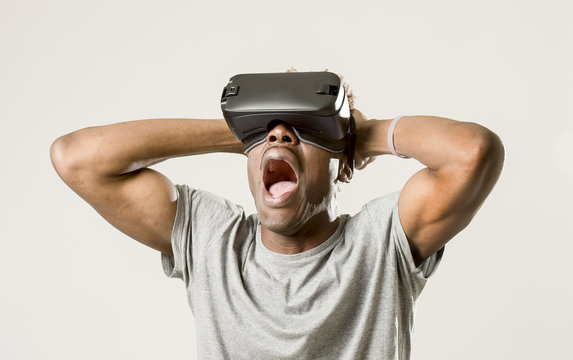 afro american man wearing virtual reality vr 360 vision goggles enjoying video game