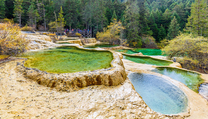 Superb colorful ponds in Huanglong National Park near Jiuzhaijou - SiChuan, China - 143990671