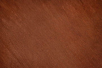Old dark brown varnished wood close up