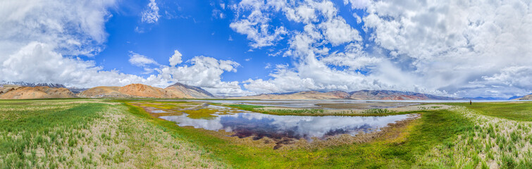 Panorama of the Tso Moriri lake near Karzok village in Rupshu valley against the background of cloudly sky - Tibet, Leh district, Ladakh, Himalayas, Jammu and Kashmir, Northern India - 143991254