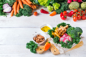 Healthy vegan buddha bowl with kale leaves and raw vegetables