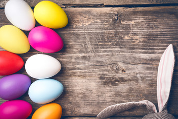 Easter bunny on old boards. Old board background. Rabbit. Easter ideas. Easter eggs. Space for text. Image in trendy toning.