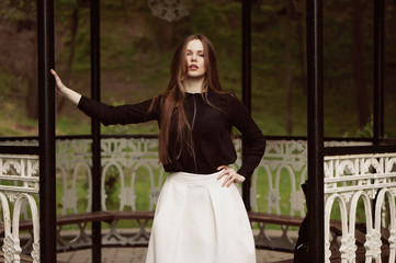 Obraz premium Woman enjoying her time in Europe park with background sunset
