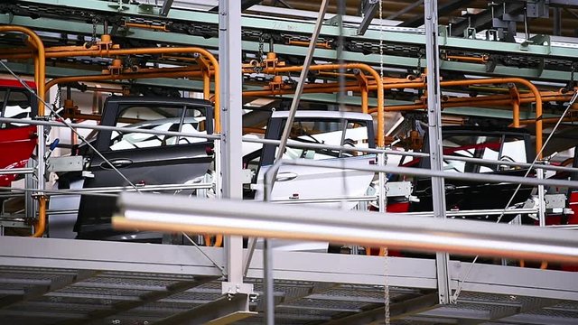 Car bodies on the production line inside automobile factory