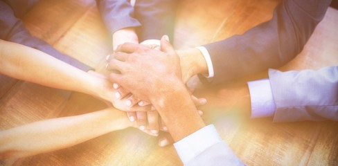 High angle view of business people stacking hands