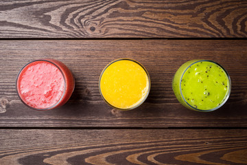 Freshly squeezed juices on wooden table
