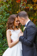 Elegant curly bride and stylish groom