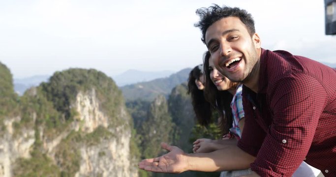 Hispanic Man Talking People On Mountain Top Enjoying Landscape, Friends Group Tourists Communication Slow Motion 60