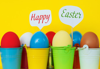 Bright  dyed eggs in colored buckets with speech bubbles. Happy Easter Card  