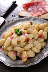 Gnocchi with prosciutto ham and cheese sauce