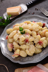 Gnocchi with prosciutto ham and cheese sauce