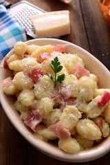 Gnocchi with prosciutto ham and cheese sauce