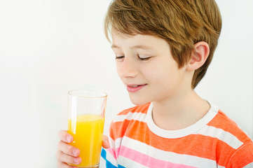 boy drink orange juice with a straw