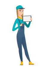 Smiling mechanic holding tablet computer.