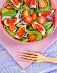 Fruit and vegetable salad with wooden fork, concept of healthy lifestyle and nutrition