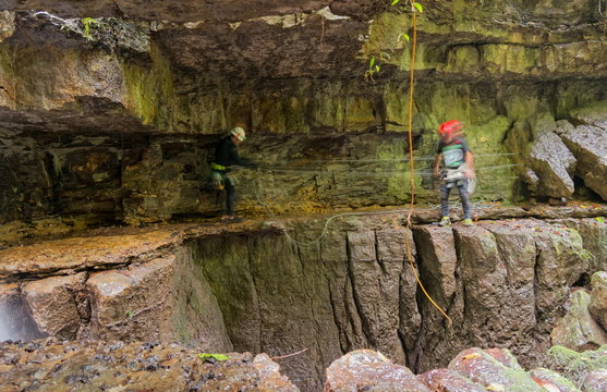 Group of explorers at Mayei Cave in Ecuador capturing stunning long exposure photographs.