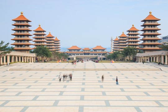 Kaohsiung, Taiwan.: Sunset at Fo Guang Shan buddist temple of Kaohsiung, Taiwan with many tourists walking by.